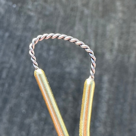 asymmetrical twisted wire rake